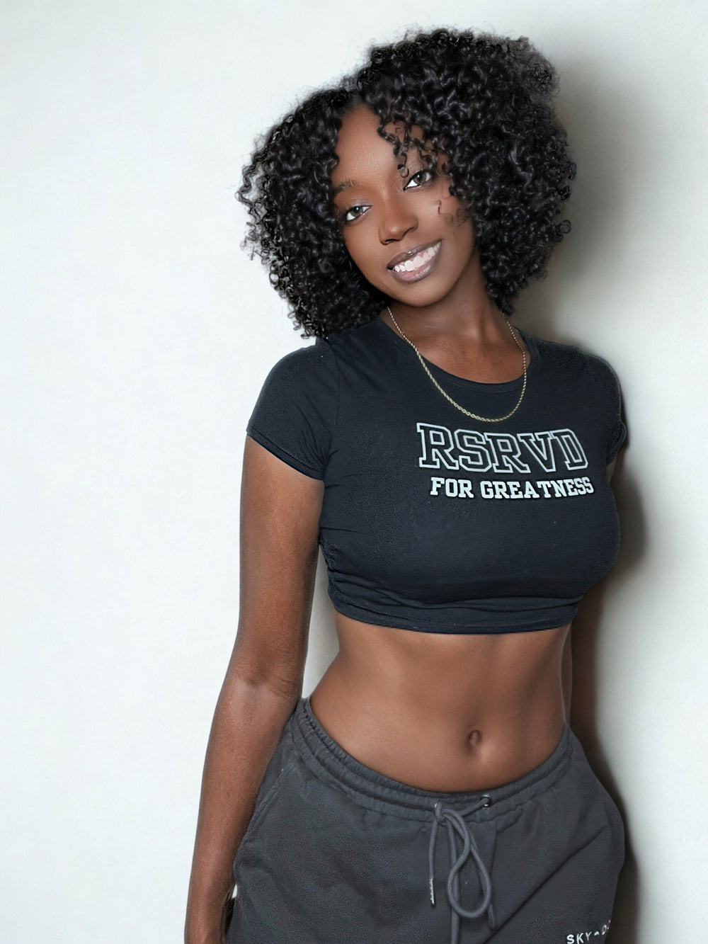 Slim Fit Crop Tee – “RSRVD for Greatness.” Printify