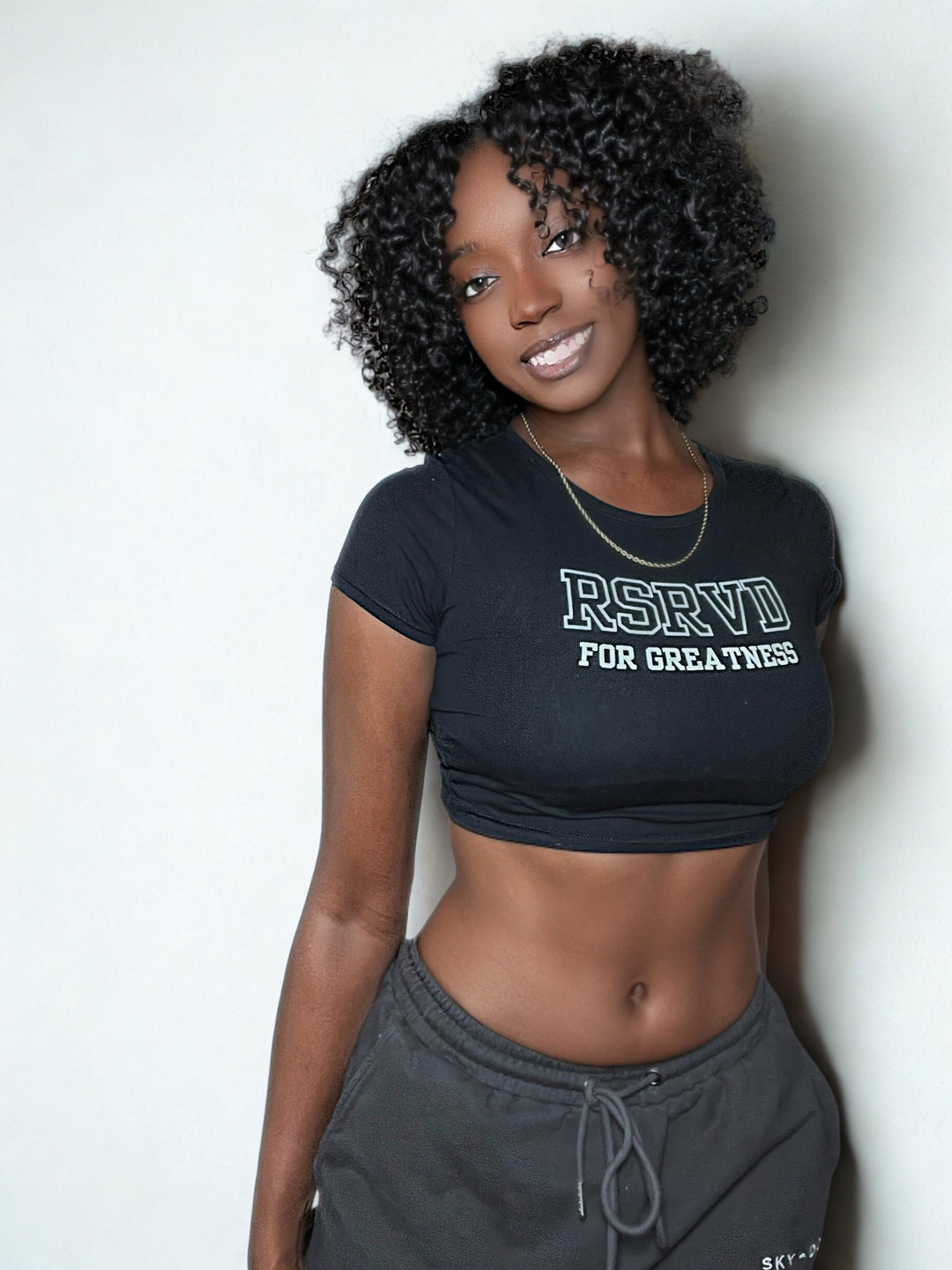 Slim Fit Crop Tee – “RSRVD for Greatness.” Printify