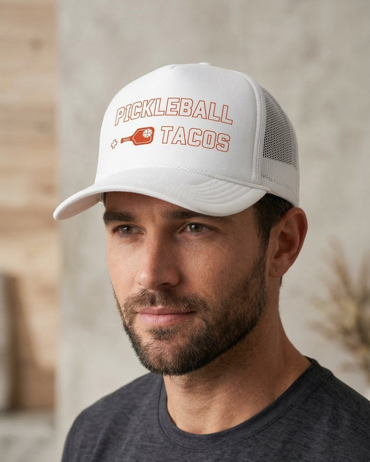 Man wearing a white cap with &