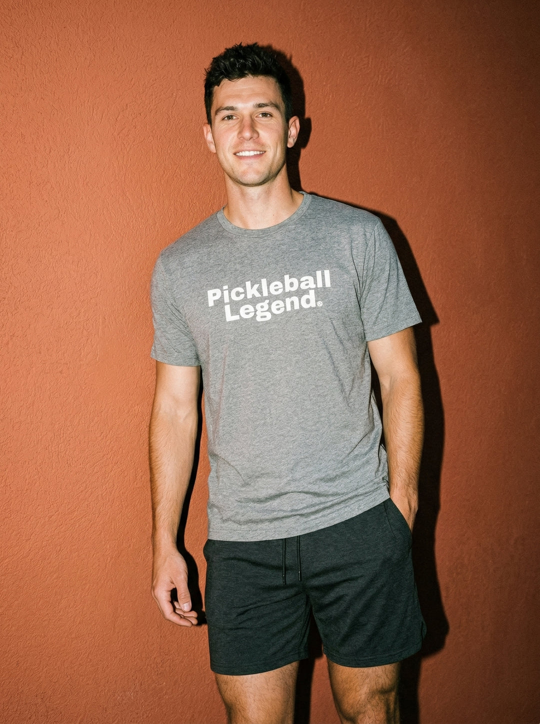 Man wearing a gray t-shirt with &
